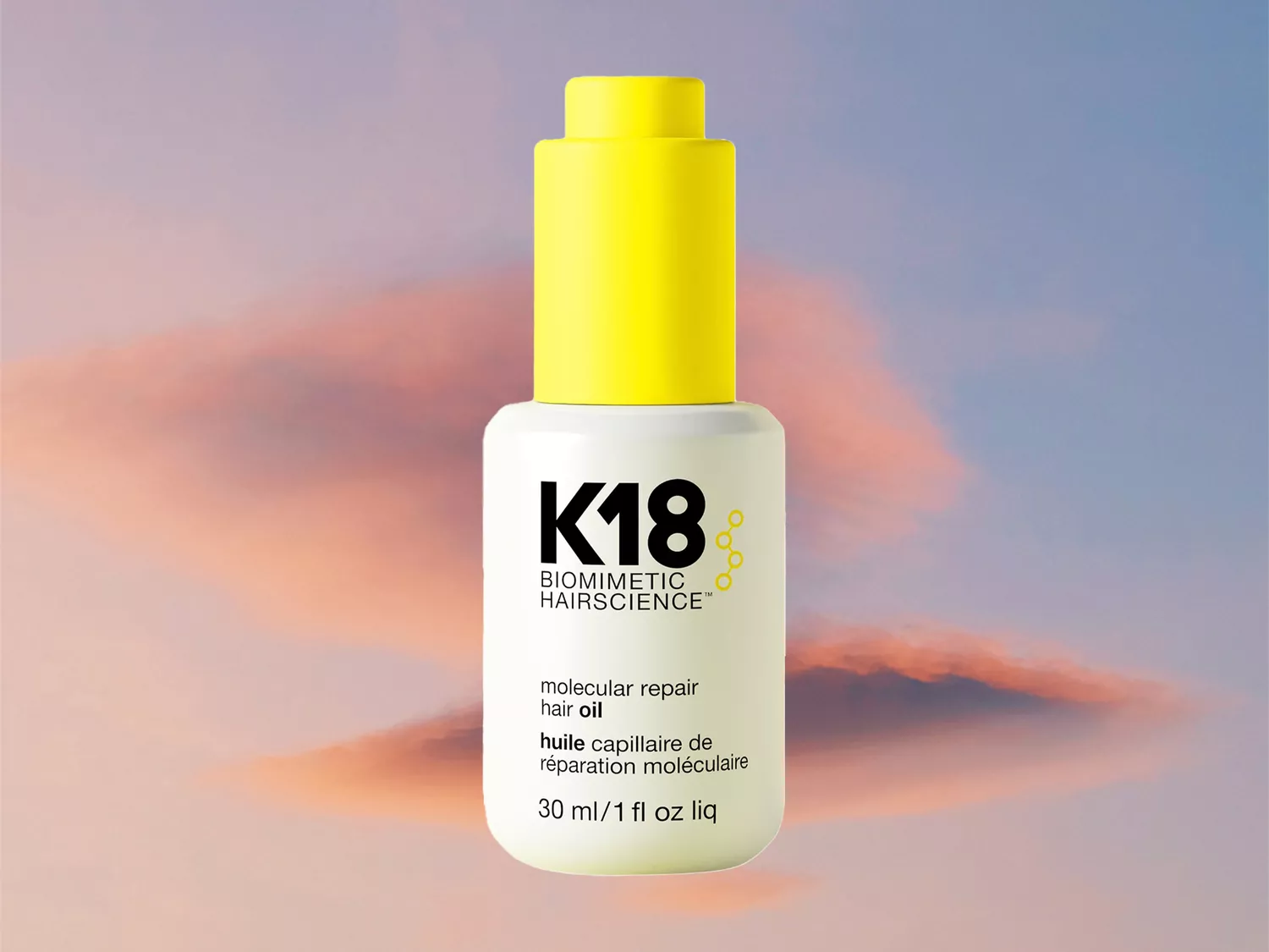 K18 Biomimetic Hair Oil on a ski background