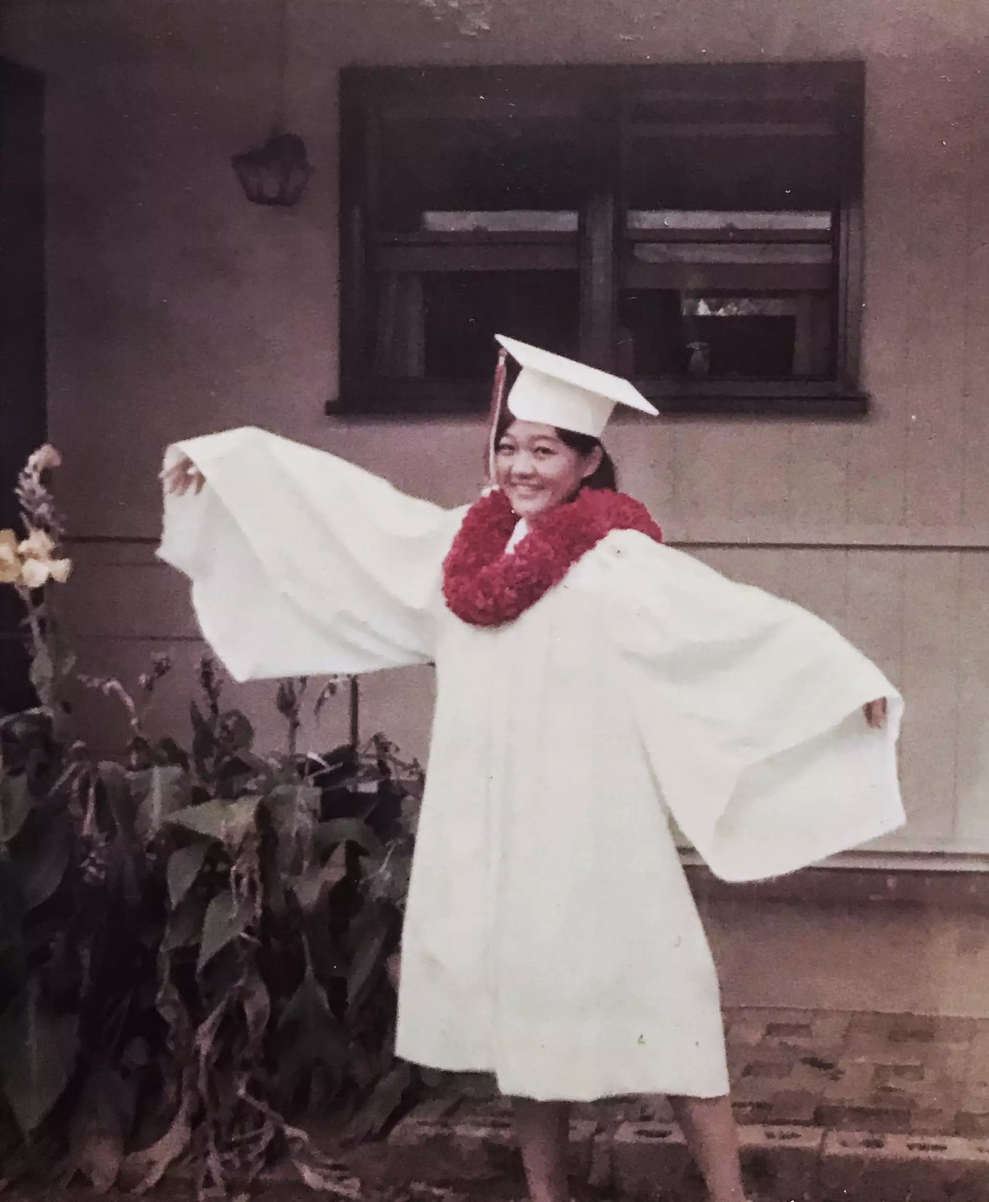 woman in graduation cap and gown
