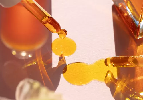 Yellow-orange liquid and droppers
