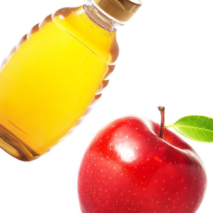 Bottle of honey and apple
