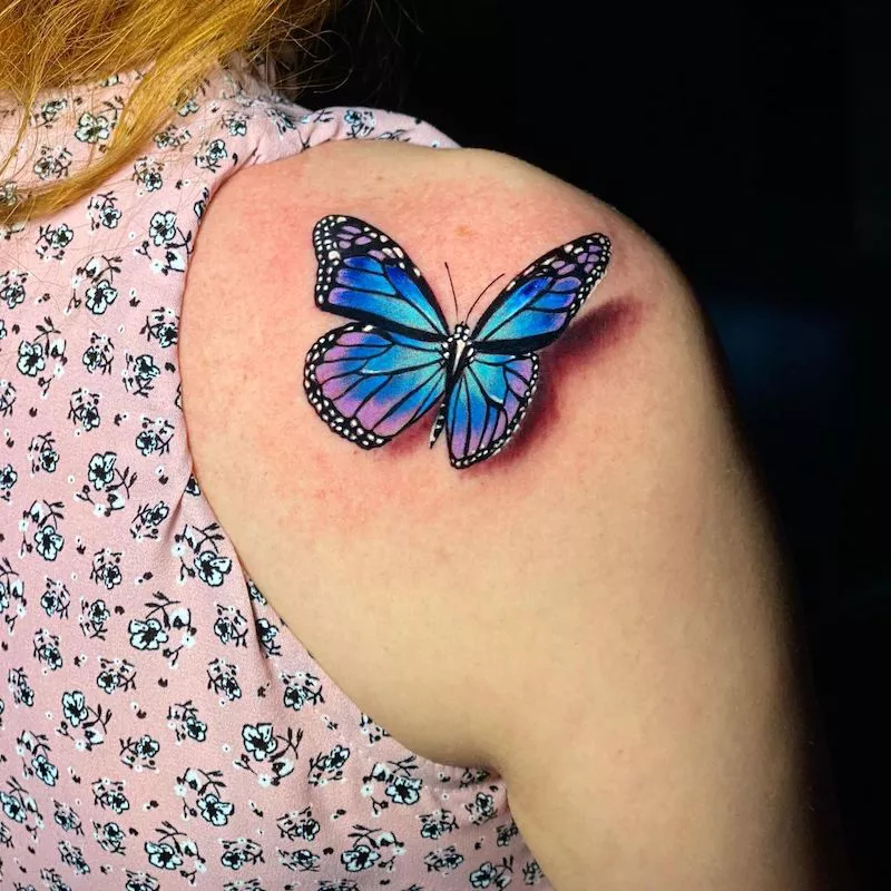 Realistic butterfly tattoo on shoulder