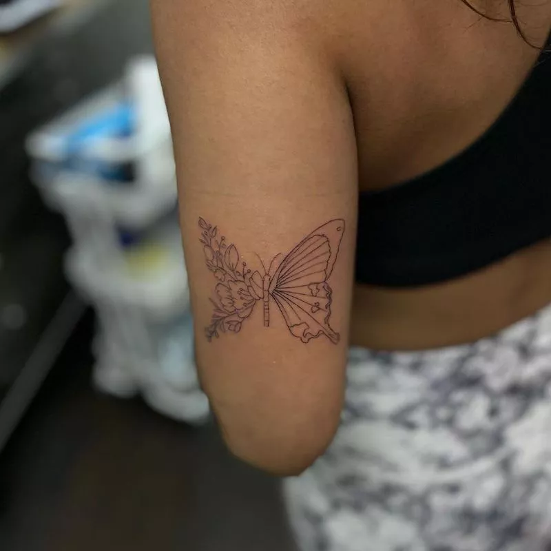 Butterfly tattoo with natural details and leaves