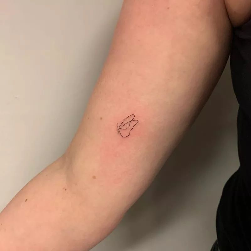 Minimal butterfly tattoo idea on arm