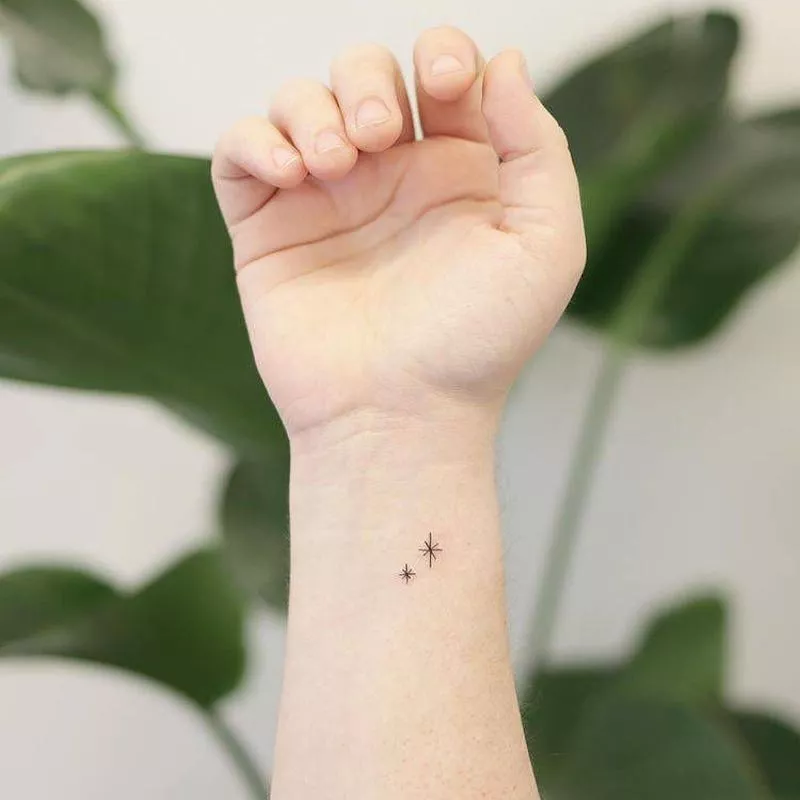 Simple pair of stars wrist tattoo