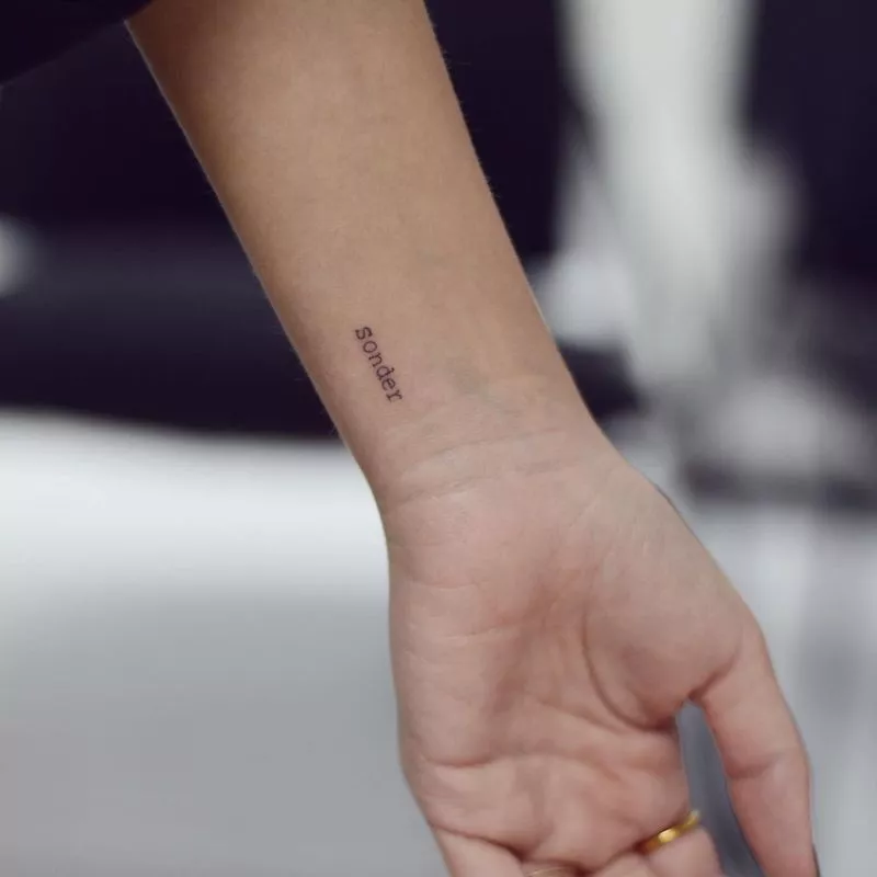 Wrist tattoo of word "sonder"