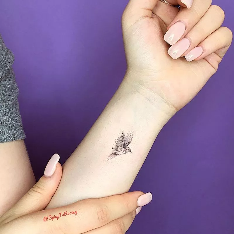 Dotted bird wrist tattoo