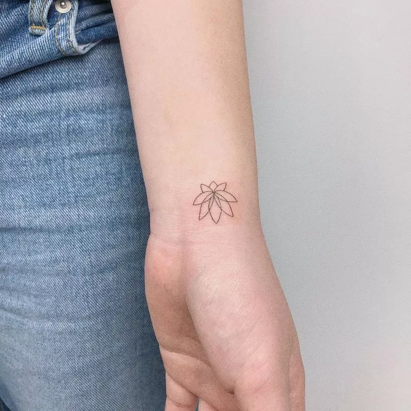 Small lotus flower wrist tattoo
