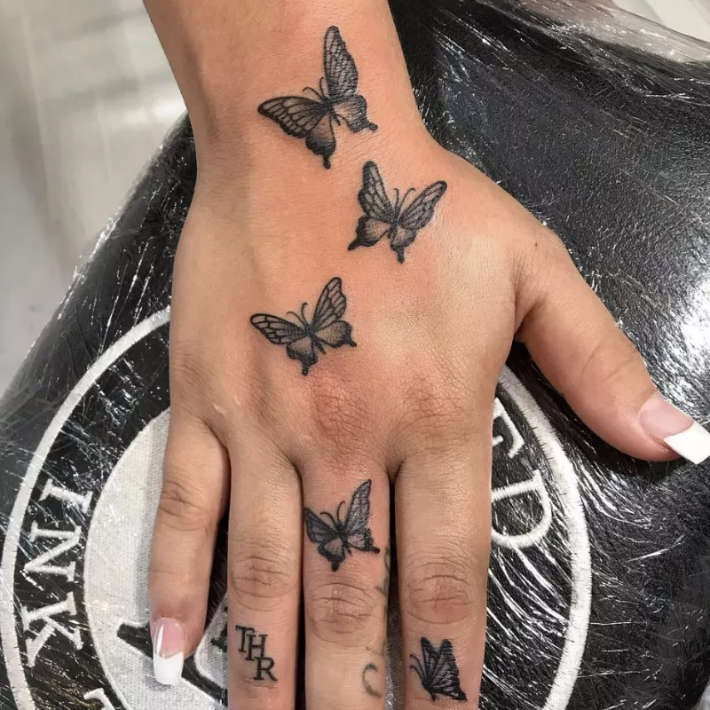 Flying butterfly hand tattoos
