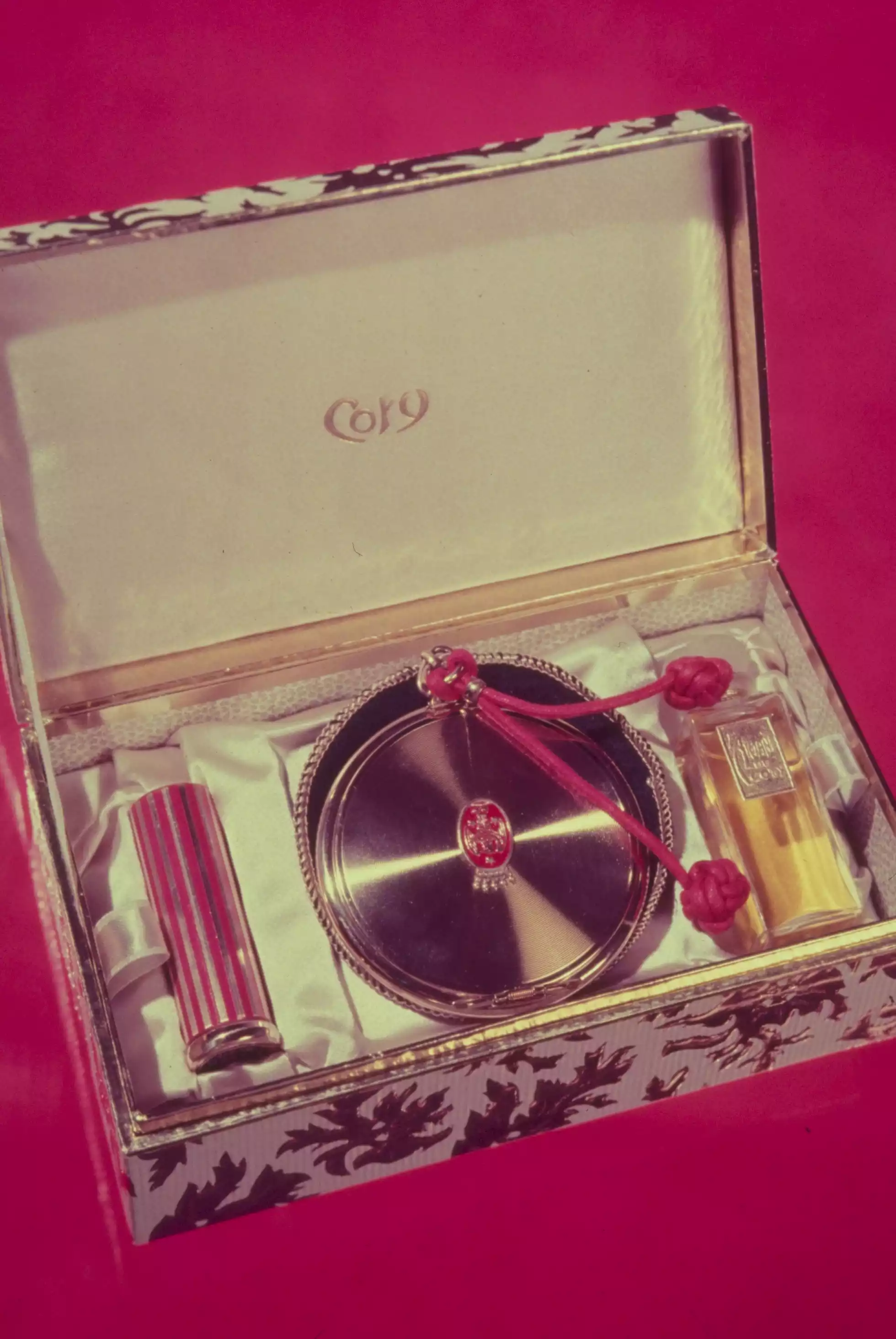 Vintage box with perfume and makeup