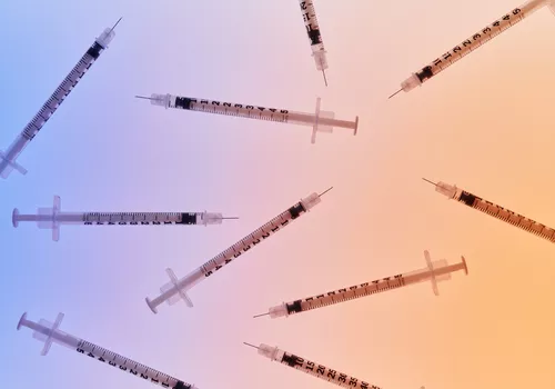 Syringes on a gradient background