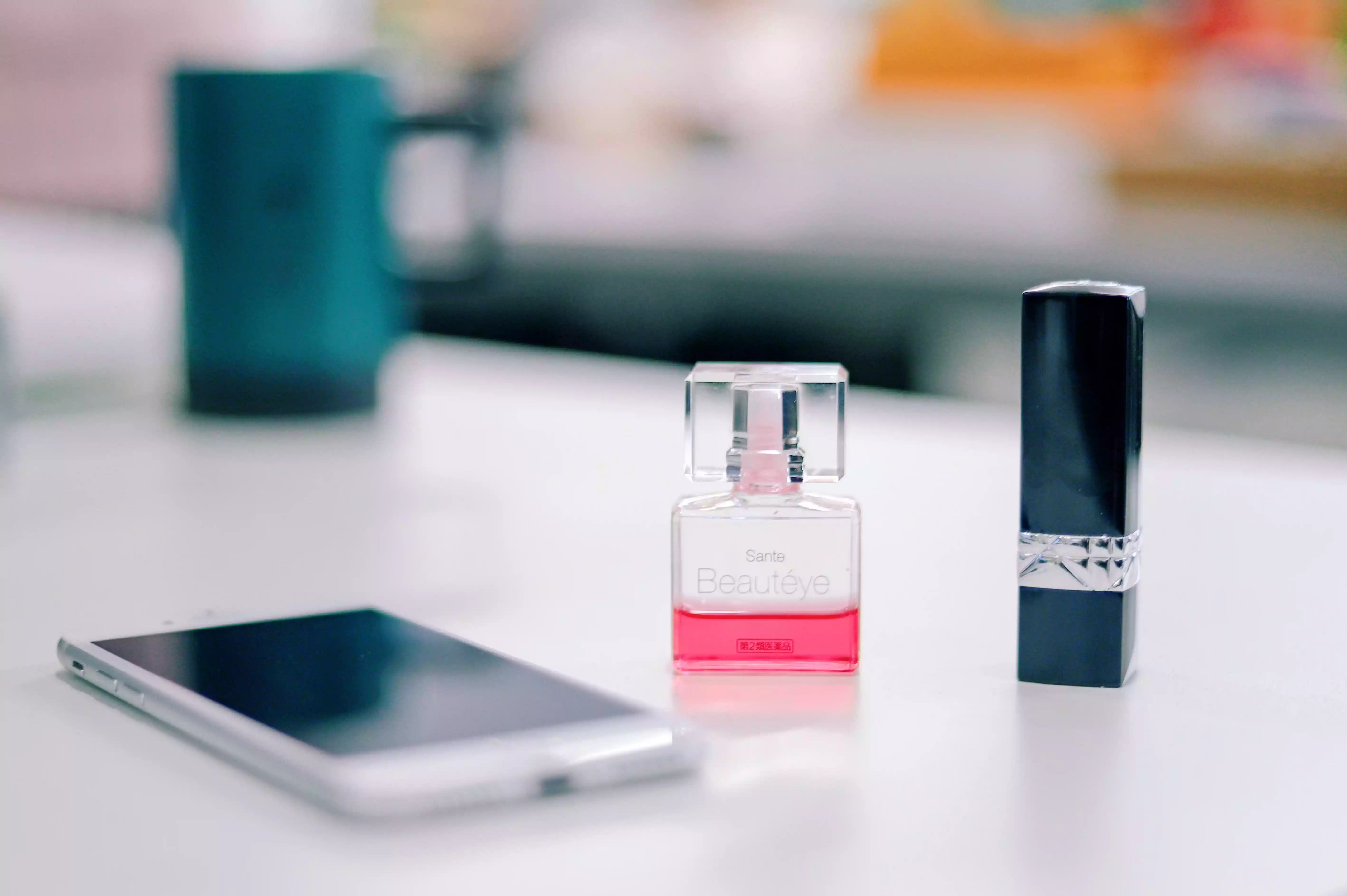 Smartphone and perfume bottle