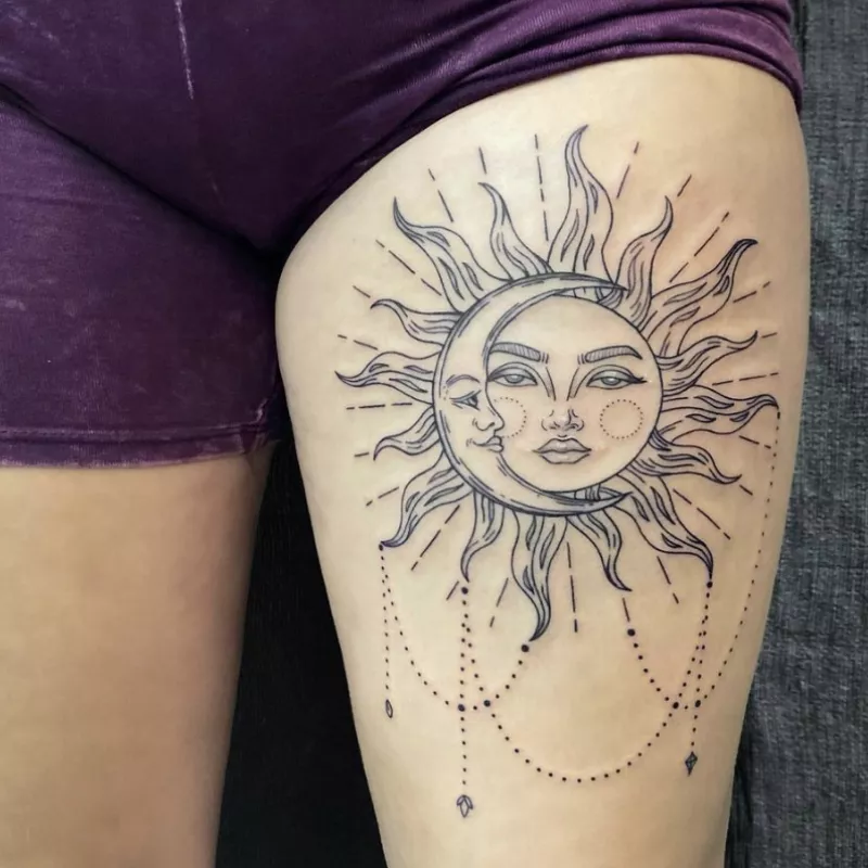 sun and moon thigh tattoo