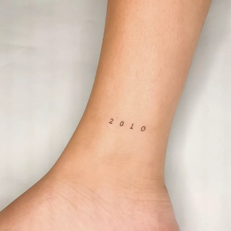 numeric "2010" tattoo on inner ankle