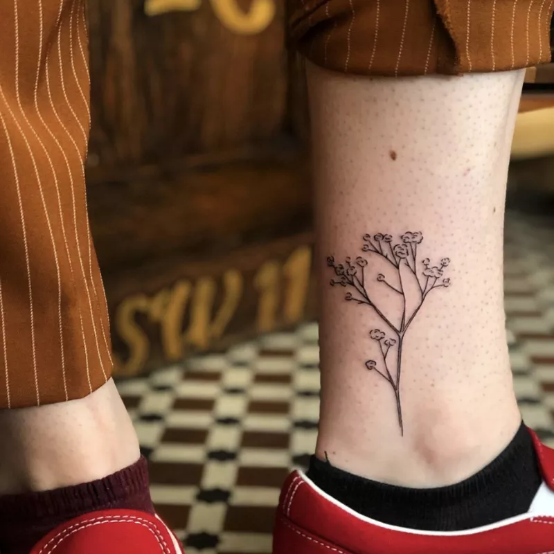 branch tattoo on ankle