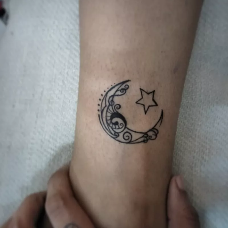 Moon and star leg tattoo