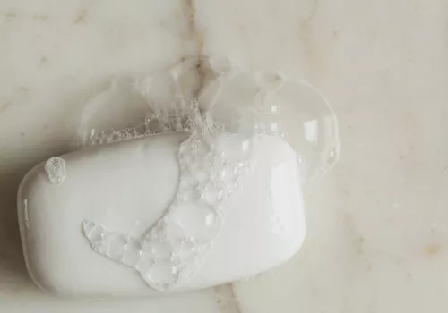 sudsy bar soap on marble surface