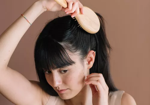 Close up of a woman brushing her hair