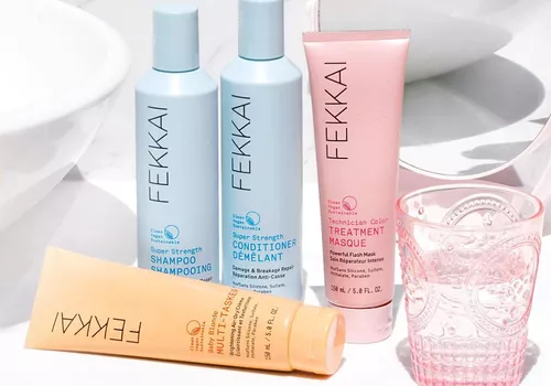 Fekkai shampoo, conditioner, treatment masque and dry cream on a bathroom sink.