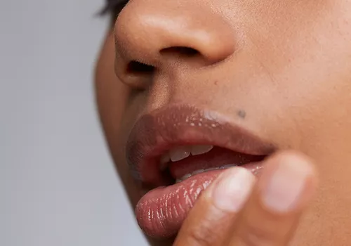 woman touching lip