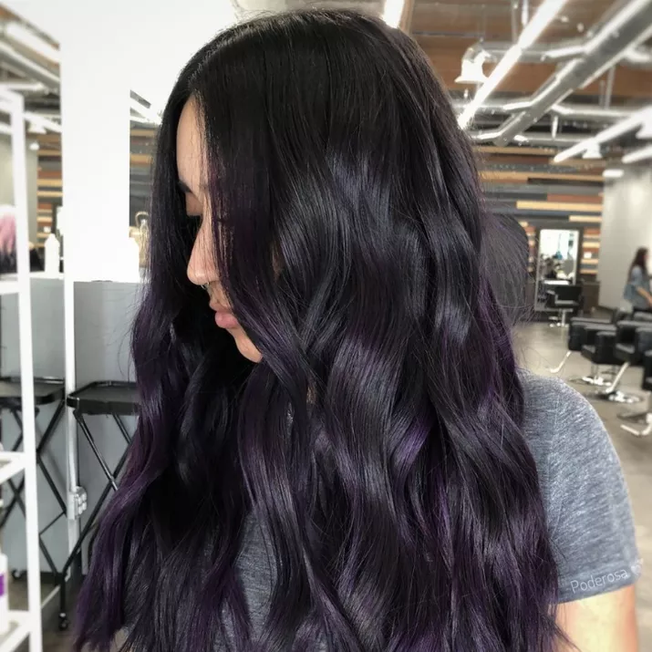 dark hair with subtle purple highlights