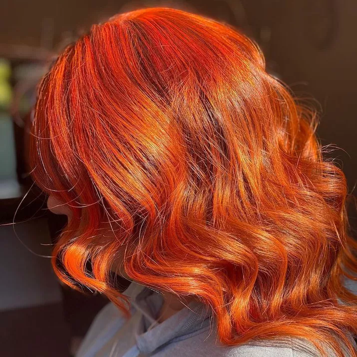 Fiery orange curled hair