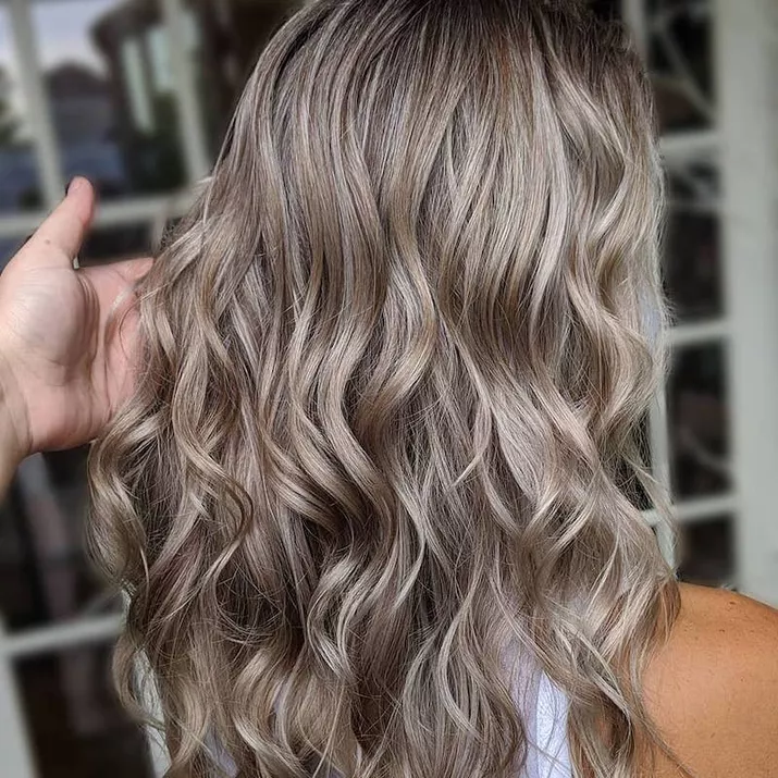 Titanium-toned blonde hair with beach waves