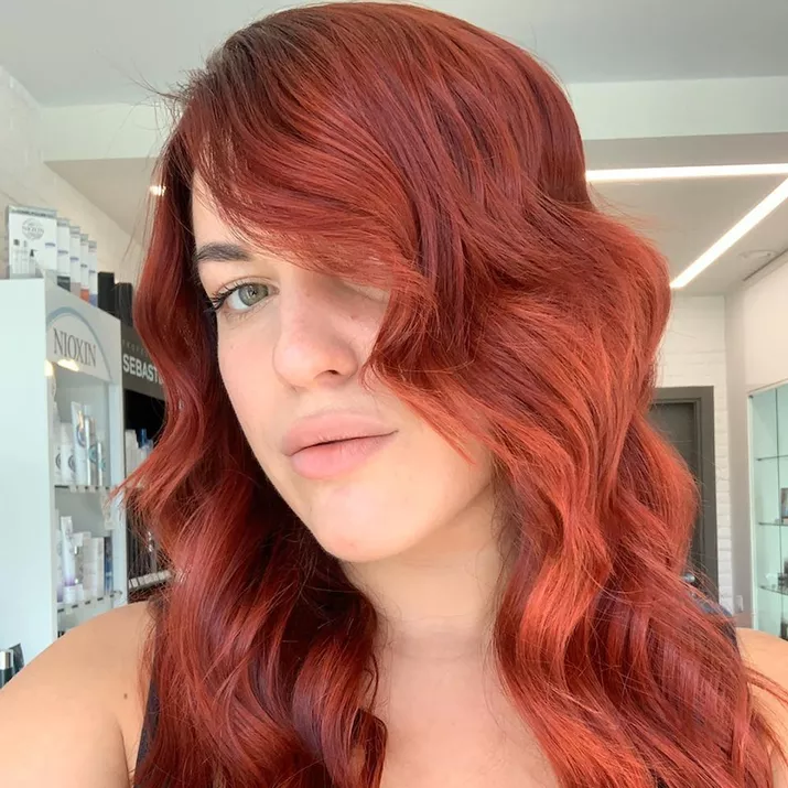 Woman with red and orange ombre waves