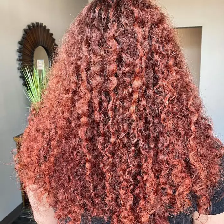 Strawberry brown curly hair viewed from back