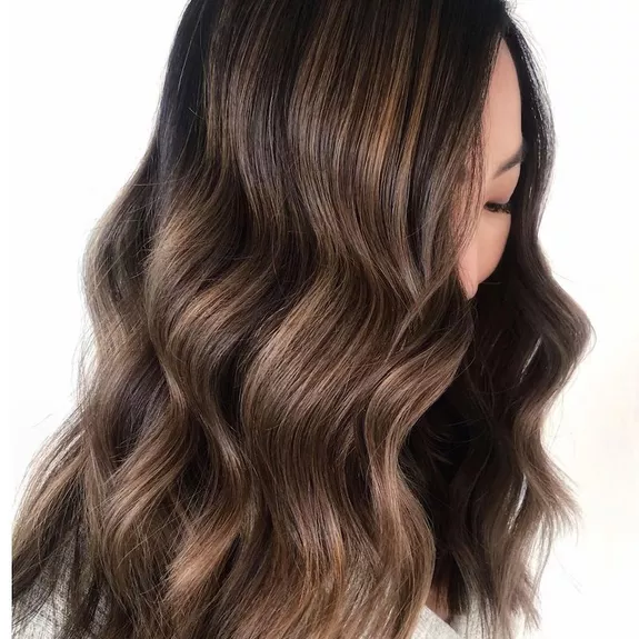 Woman with dimensional reverse balayage hair color