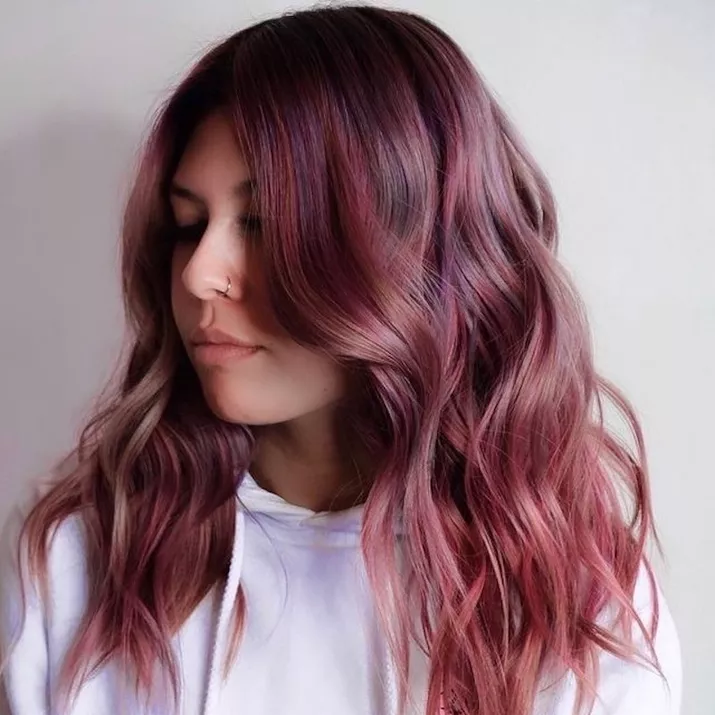 Woman with melted strawberry brown hair color