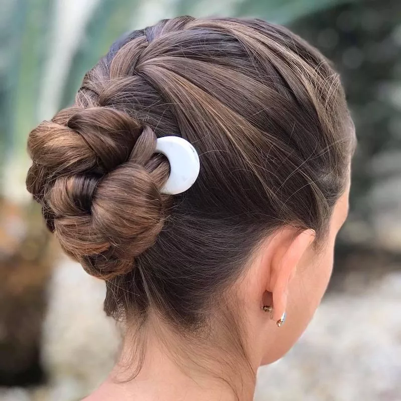 Braided bun hairstyle with French pins