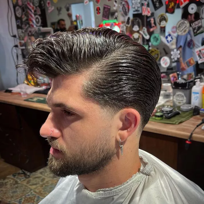 Side profile of voluminous rockabilly 1950s men's hairstyle