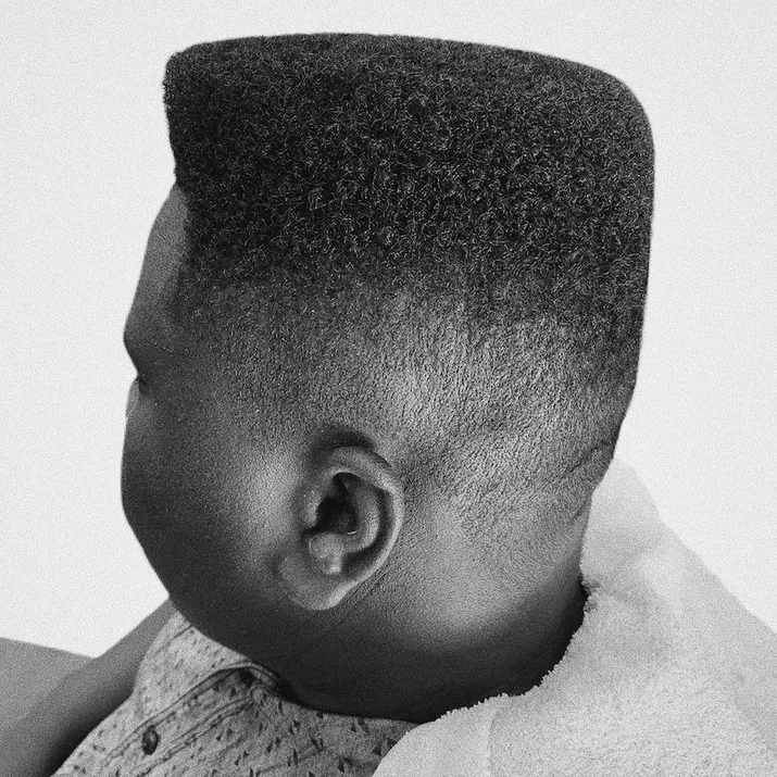 Side view of 1950s-inspired men's flat top hairstyle