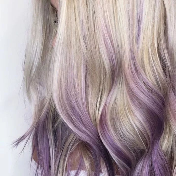Long blonde hair with purple balayage highlights