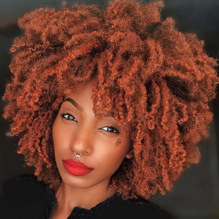 Woman with ginger orange curly Afro hairstyle