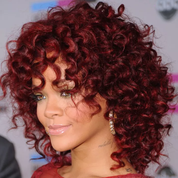 Rihanna with burgundy spiral hair