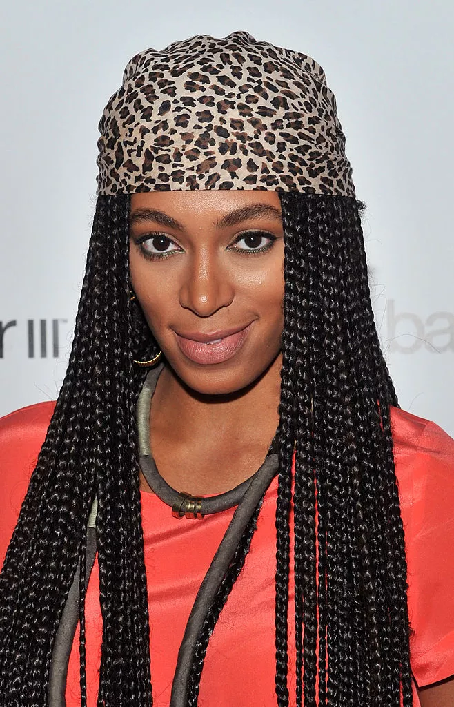 Solange wearing a scarf with her braids