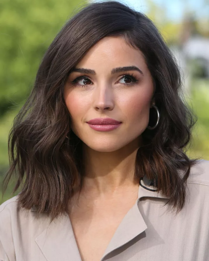 Olivia Culpo wavy lob with side part and blunt ends