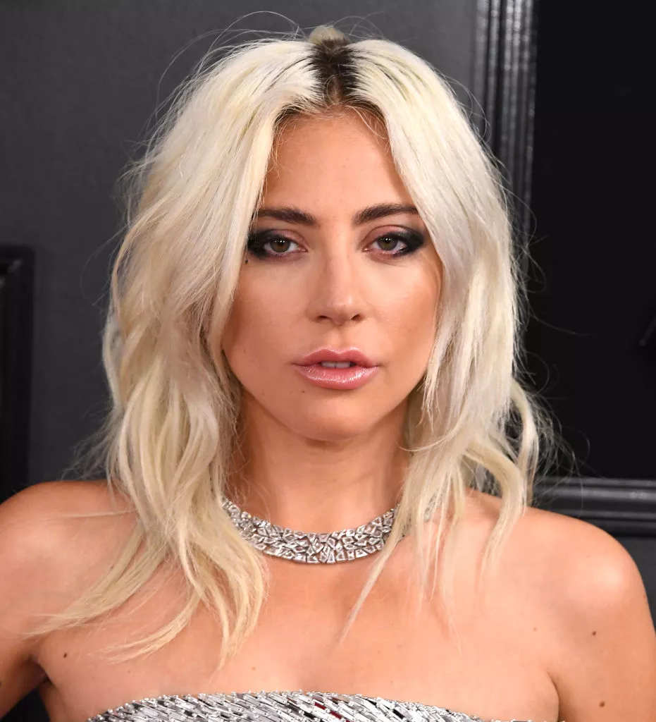 Lady Gaga platinum mid-length wavy hair with dark roots