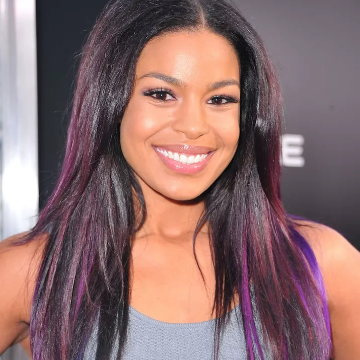 Jordin Sparks with long, dark hair and purple highlights