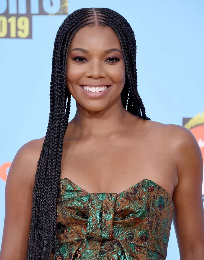 Gabrielle Union with long braids and a center part