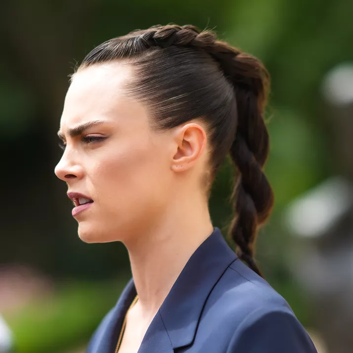 Cara Delevingne with a braid/twist hairstyle