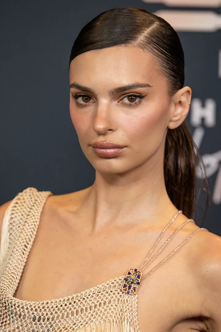 Emily Ratajkowski in a deep side parted hairstyle