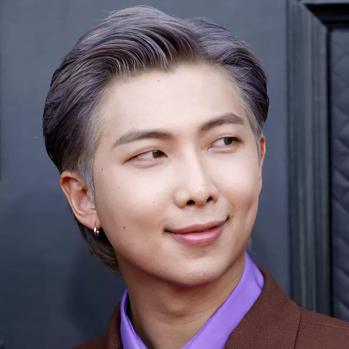 RM of BTS wears a purple-gray slicked back 1950s men's hairstyle