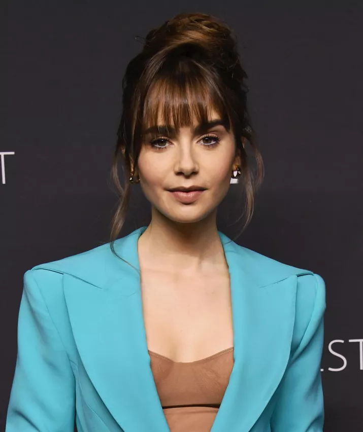 Lily Collins updo with wispy bangs