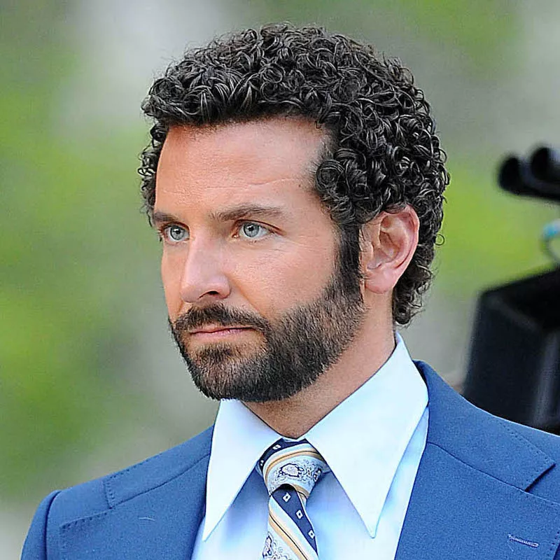 Bradley Cooper wears a tight perm hairstyle on the set of American Hussle