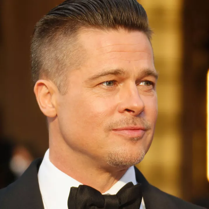 Brad Pitt wears a pompadour fade hairstyle to the 2014 Oscars