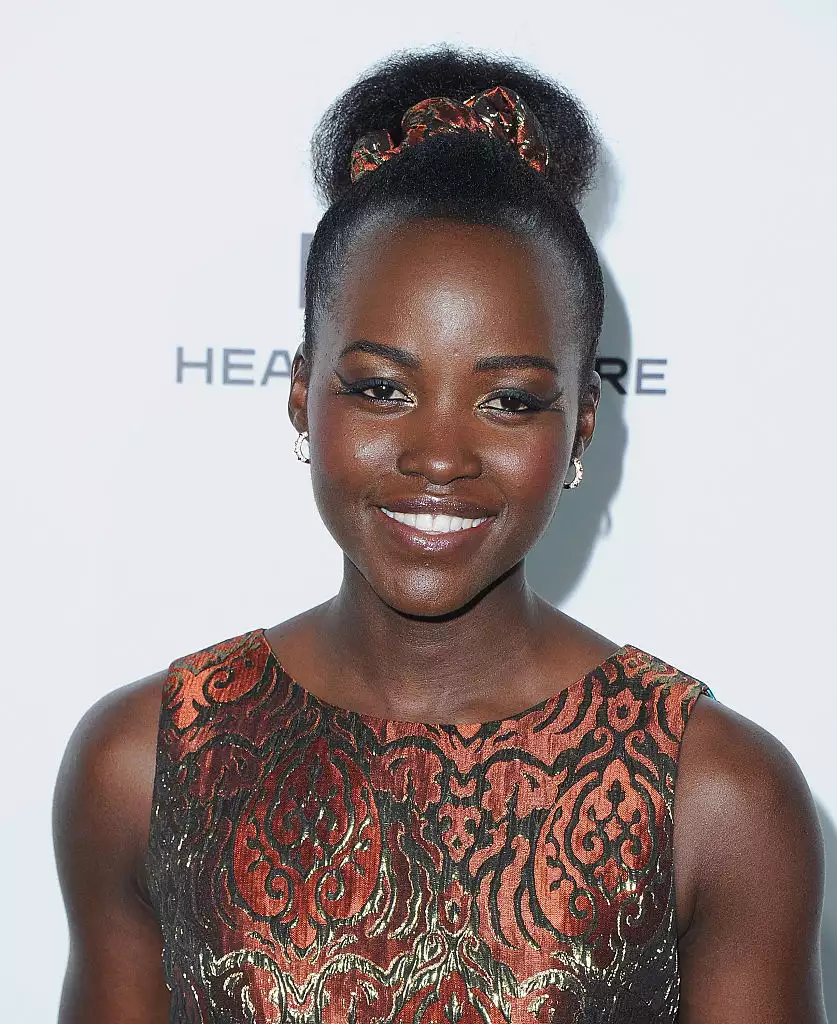 Lupita Nyongâo on the red carpet with a scrunchie