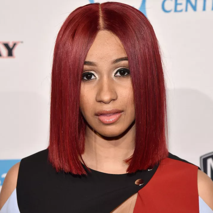 Cardi B with a burgundy-berry colored lob