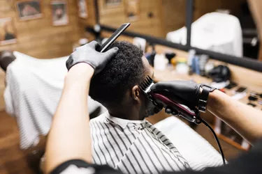 Man getting a trim at a barbershop